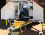 The mast is integrated onto a tilting system to allow for payload assembly at ground level, negating the need for any work from a ladder or platform.