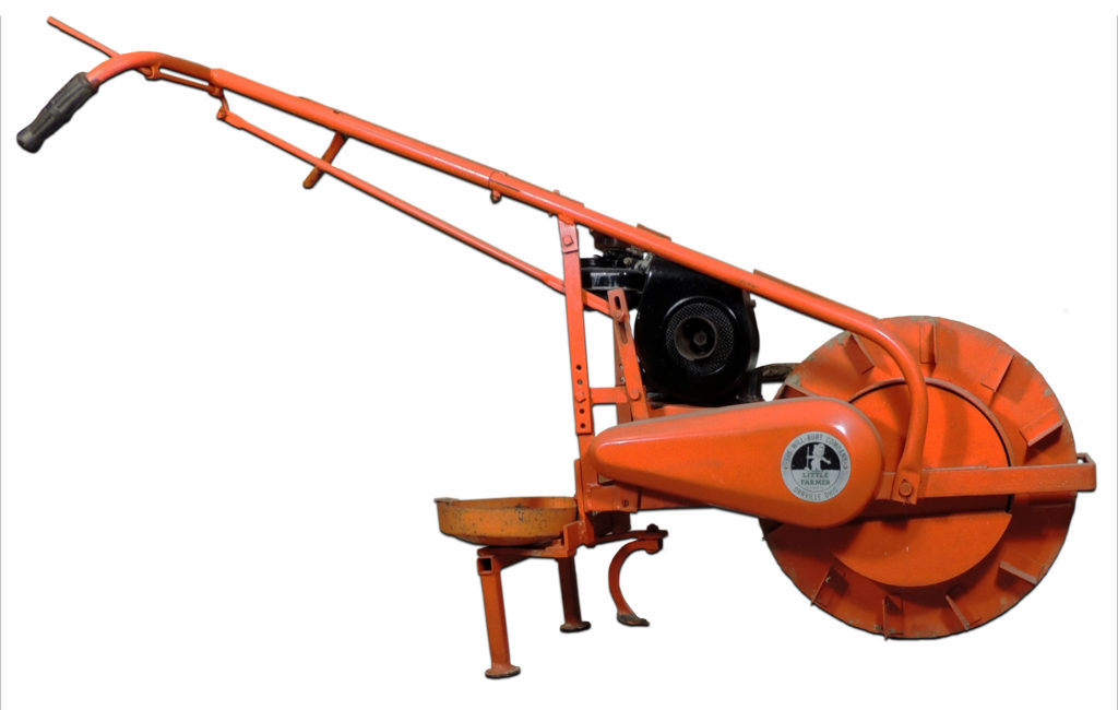 One such product was The Little Farmer Power Cultivator. In 1949, Ed Baer designed this unique machine for the home gardener, along with several optional accessory implements.